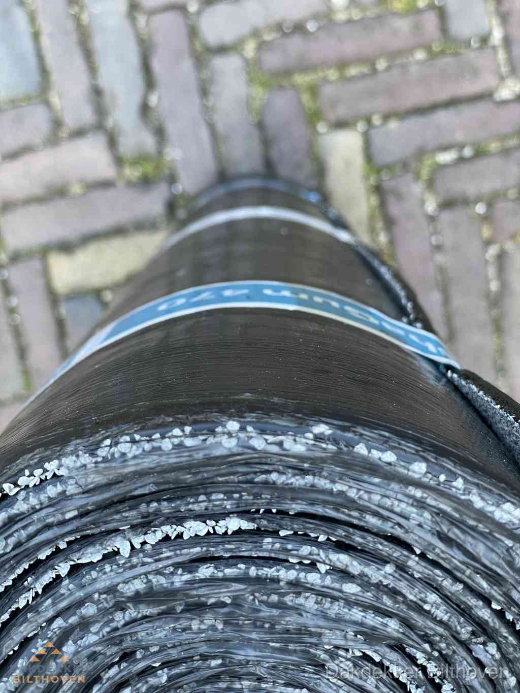 Rol bitumen dakleer met leislag voor plat dak in Bilthoven